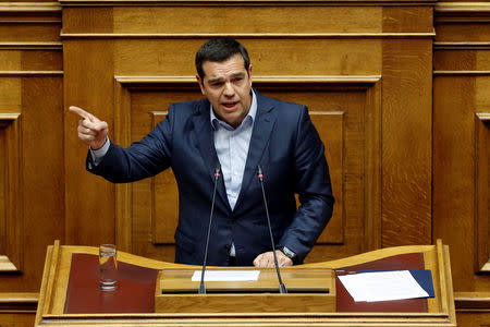 Greek Prime Minister Alexis Tsipras addresses lawmakers during a parliamentary session before a vote on German World War II reparations in Athens, Greece April 17, 2019. REUTERS/Costas Baltas