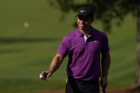 Paul Casey, of England, holds up his ball after putting on the seventh green during the final round of the Masters golf tournament Sunday, Nov. 15, 2020, in Augusta, Ga. (AP Photo/Chris Carlson)