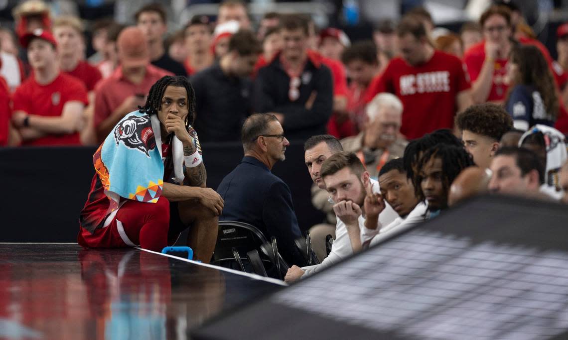 N.C. State’s Breon Pass (10) sits at the end of the bench as Purdue opens a 12 point lead over the Wolfpack in the second half during the NCAA Final Four National Semifinal game on Saturday, April 6, 2024 at State Farm Stadium in Glendale, AZ. Robert Willett/rwillett@newsobserver.com