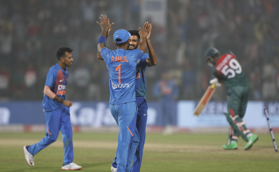 India's Khaleel Ahmed, center, celebrates the wicket of Bangladesh's Soumya Sarkar during the first T20 cricket match at the Arun Jaitley stadium, in New Delhi, India, Sunday, Nov. 3, 2019. (AP Photo/Manish Swarup)