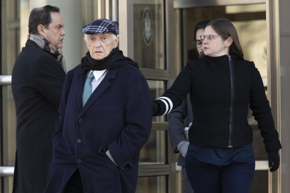 Jose Margulies, center, leaves federal court following his sentencing, Tuesday, Jan. 21, 2020, in the Brooklyn borough New York. A federal judge in Brooklyn sentenced Brazilian broadcast executive Margulies to two years' probation on Tuesday for acting as an intermediary in a scheme to exchange bribes for the media rights to South American soccer tournaments. (AP Photo/Mary Altaffer)