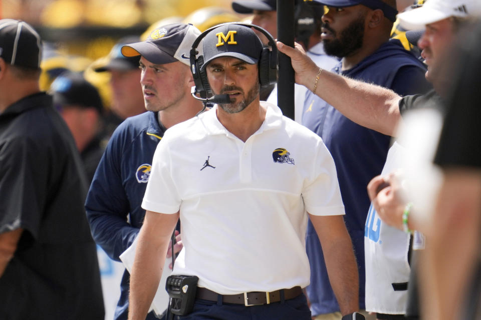 Michigan head coach defensive coordinator Jesse Minter watches against East Carolina in the first half of an NCAA college football game in Ann Arbor, Mich., Saturday, Sept. 2, 2023. (AP Photo/Paul Sancya)