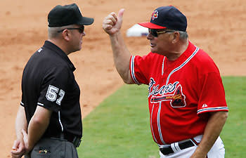 Umpires like Mike Everitt (left) won't have Bobby Cox to eject, something that has happened a record 158 times. (Mike Zarrilli/Getty)