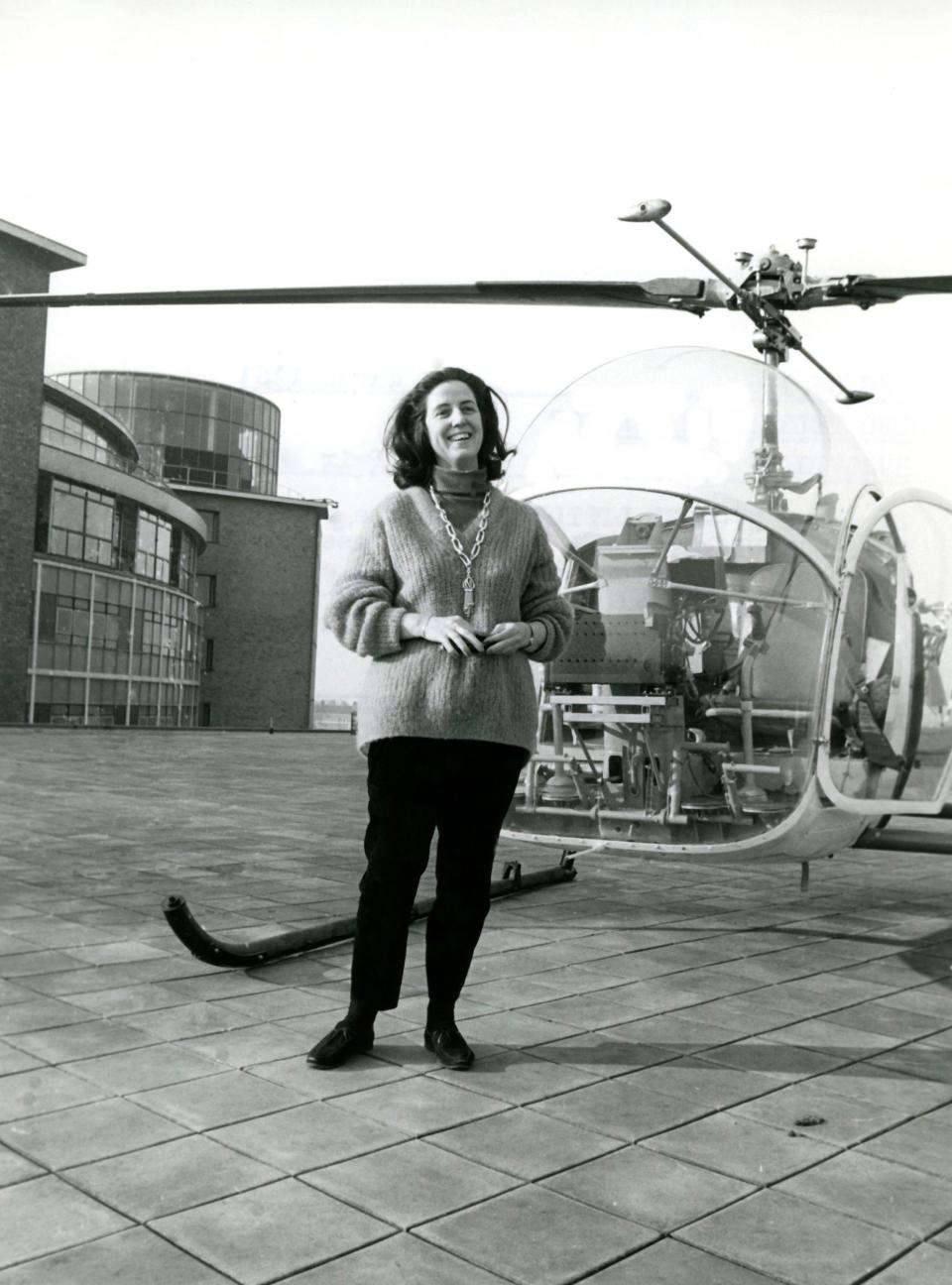 Yvonne Littlewood on the roof of studio 1  at BBC Televison Centre, with the  helicopter used to film aerial shots of  the centre for the opening sequence of the 1963 Eurovision Song Contest finals