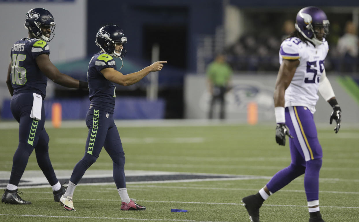 Seattle K Blair Walsh gestures to the Minnesota sideline after making a 52-yard kick on Friday. (AP)