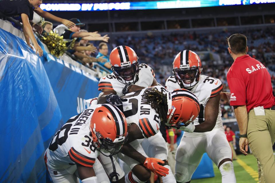 Cleveland Browns safety Jovante Moffatt (35), safety D'Anthony Bell (37) and cornerback A.J. Green (38) celebrate a touchdown score from cornerback Martin Emerson Jr. (23) during the second quarter of a preseason NFL game against the Jacksonville Jaguars on Friday, Aug. 12, 2022 at TIAA Bank Field in Jacksonville. [Corey Perrine/Florida Times-Union]