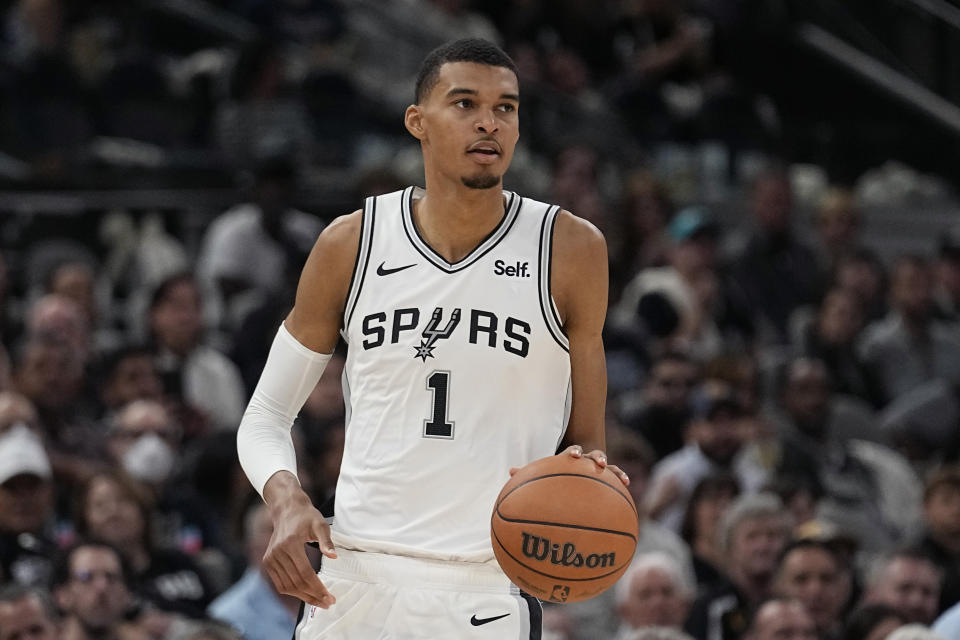 San Antonio Spurs center Victor Wembanyama brings the ball up against the Dallas Mavericks during the second half of an NBA basketball game in San Antonio, Wednesday, Oct. 25, 2023. (AP Photo/Eric Gay)