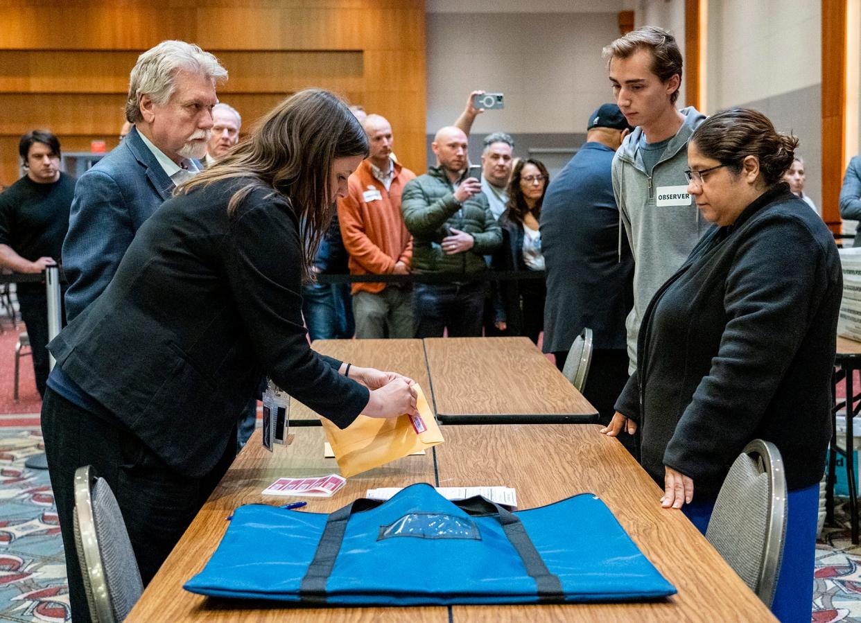 Milwaukee Election Commission Executive Director Claire Woodall finalizes the ballot counting process by exporting results from tabulators, as election observers challenge the seal process of the USB drive on Tuesday November 8, 2022 at Central Count at the Wisconsin Center in Milwaukee, Wis.