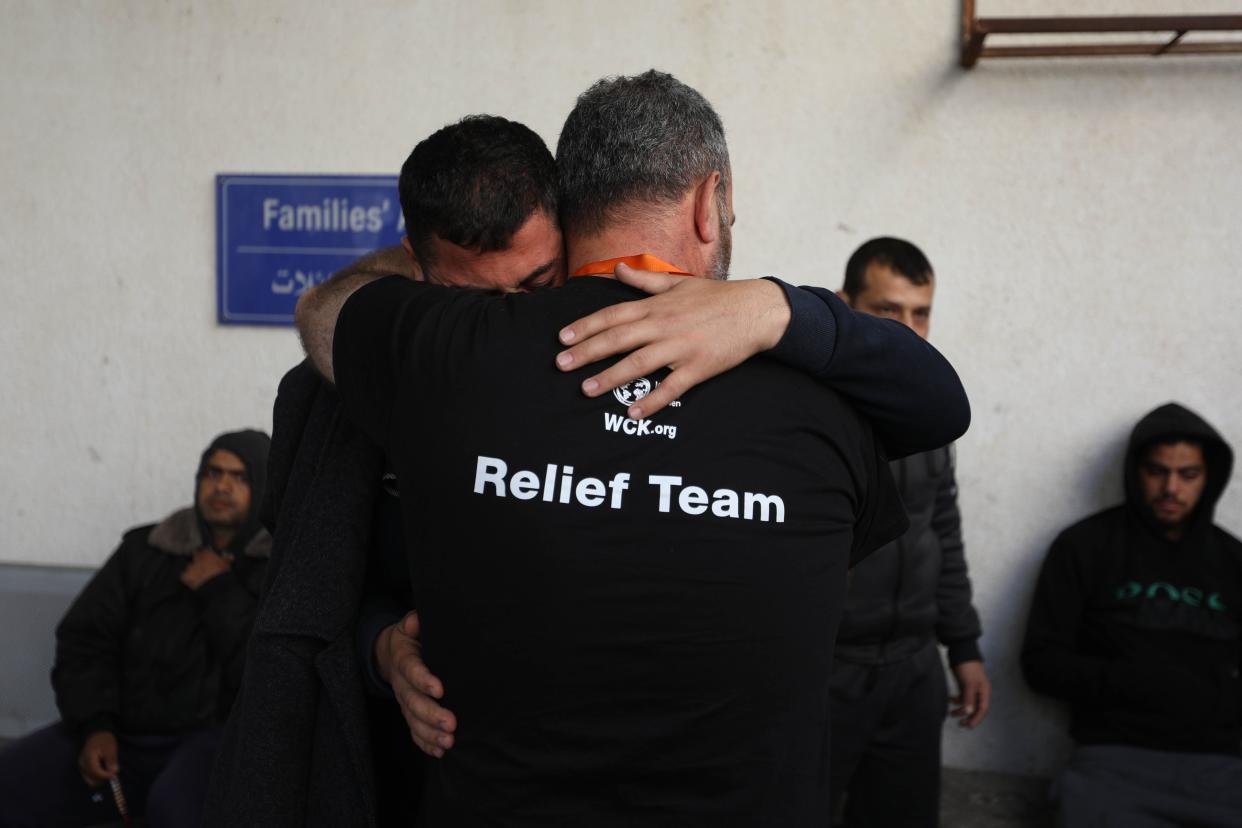 Two men become emotional and comfort each other as they receive the bodies of World Central Kitchen workers who were killed by Israeli air strikes on April 02, 2024 in Rafah, Gaza. (Photo by Ahmad Hasaballah/Getty Images)