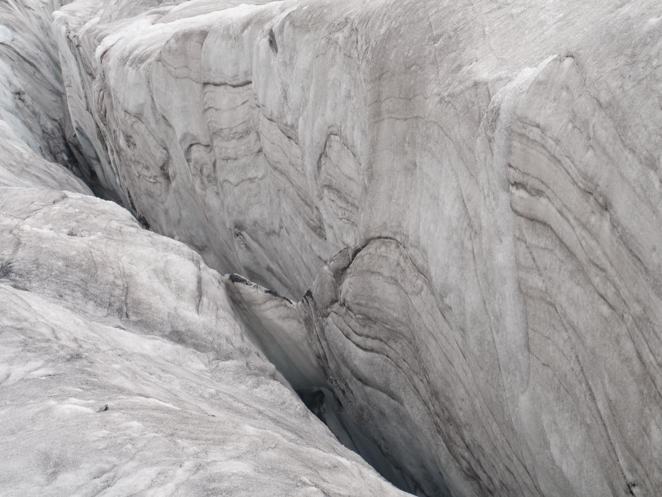 This Sept. 22, 2018 photo shows the Baishui Glacier No.1 on the Jade Dragon Snow Mountain in the southern province of Yunnan in China. Scientists say the glacier is one of the fastest melting glaciers in the world due to climate change and its relative proximity to the Equator. It has lost 60 percent of its mass and shrunk 250 meters since 1982. (AP Photo/Sam McNeil)