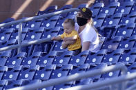 A San Diego Padres fan watches the second inning of a spring training baseball game against the Chicago Cubs, Monday, March 1, 2021, in Peoria, Ariz. (AP Photo/Charlie Riedel)