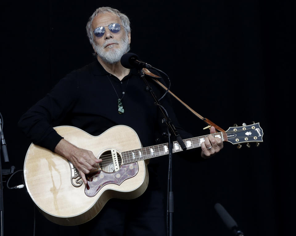 Yusuf Islam/Cat Stevens sings during a national remembrance service in Hagley Park for the victims of the March 15 mosque terrorist attack in Christchurch, New Zealand, Friday, March 29, 2019. (AP Photo/Mark Baker)