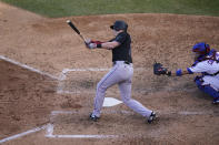 Miami Marlins' Garrett Cooper follows through on a solo home run during the seventh inning in Game 2 of a National League wild-card baseball series against the Chicago Cubs Friday, Oct. 2, 2020, in Chicago. (AP Photo/Nam Y. Huh)