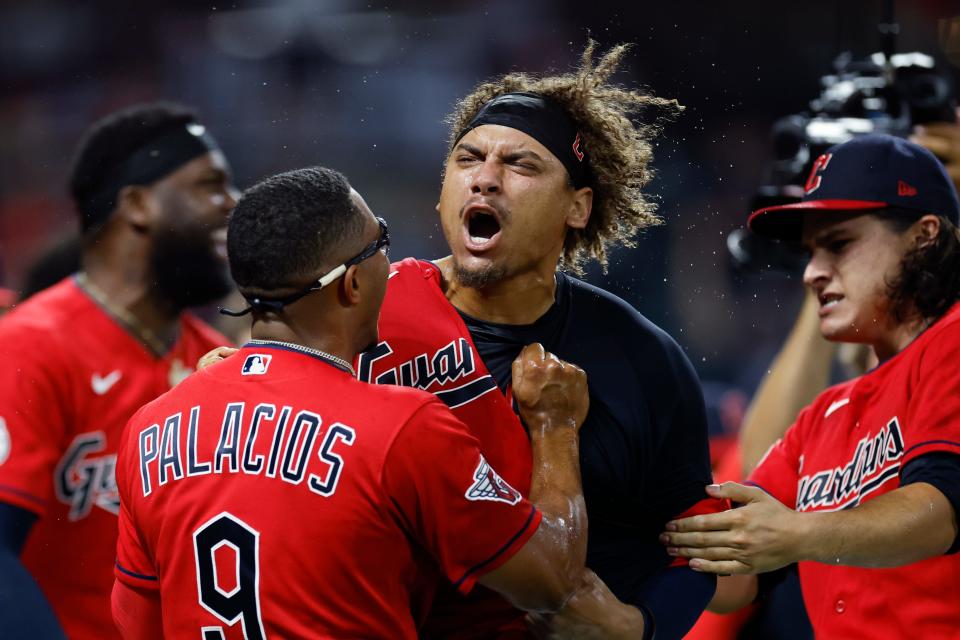 Cleveland Guardians' Josh Naylor, center, celebrates with Richie Palacios and Eli Morgan after hitting a game-ending, two-run home run in the 10th inning against the Minnesota Twins, Wednesday, June 29, 2022, in Cleveland. (AP Photo/Ron Schwane)