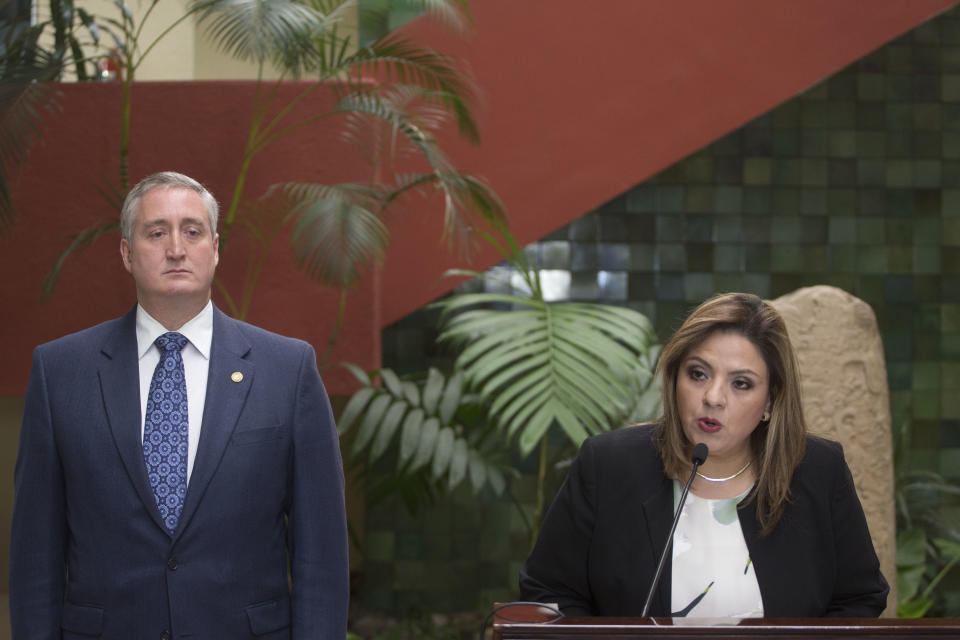 Foreign Minister Sandra Jovel, right, gives a press conference accompanied by Interior Minister Enrique Degenhart, in Guatemala City, Monday, Sept. 17, 2018. The Guatemalan government will defy a ruling by the country's top court and block the return of Ivan Velasquez, who is leading a U.N.-backed anti-corruption commission. (AP Photo/Moises Castillo)