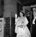 <p>A smiling Queen Elizabeth II waves to the crowds as she leaves the Royal Variety Show at Victoria Palace in 1960. (PA Archive) </p>