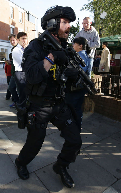 Armed police are on the scene at Parsons Green - Credit: AFP