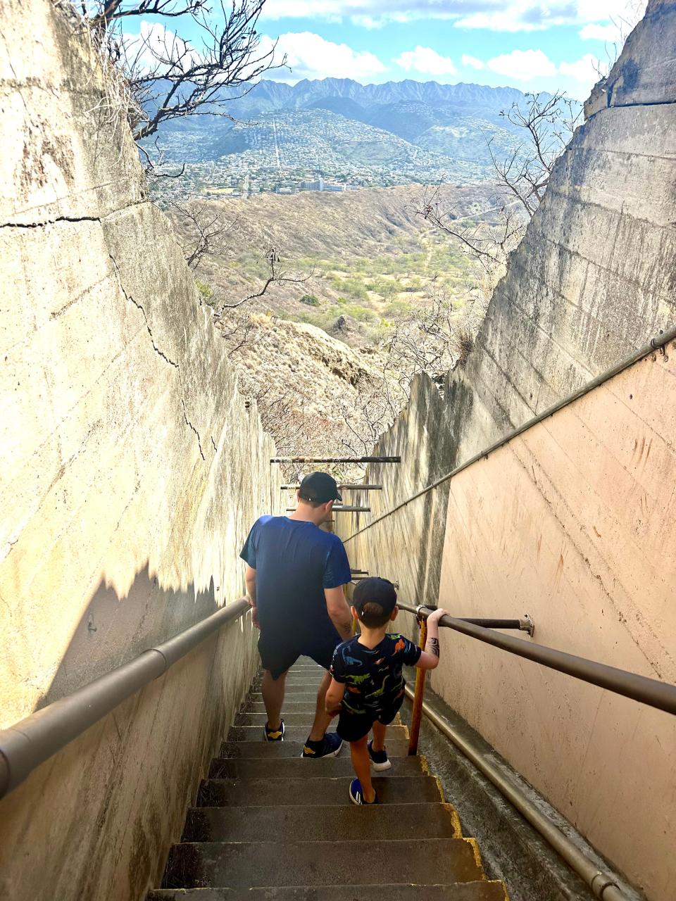Nicole Findlay's husband and son walking down the steep staircase at Diamond Head.