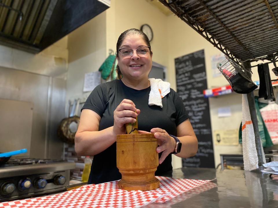 Jannette Carillo opened the Isla del Coqui over 20 years ago. The restaurant serves typical Puerto Rican dishes such as fish fillet in creole sauce, mofongo - a stacked dish with a base of mashed, green plantains - and lechon - a soft pork roast.