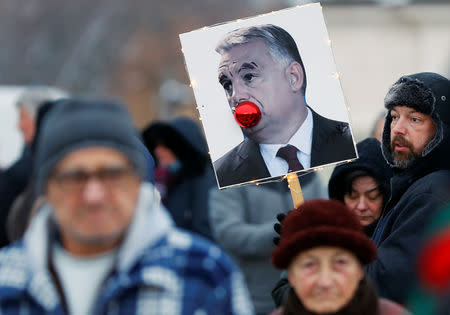 A placard depicting Hungarian Prime Minister Viktor Orban is pictured during a protest against a proposed new labor law, billed as the "slave law" in Budapest, Hungary, December 16, 2018. REUTERS/Leonhard Foeger