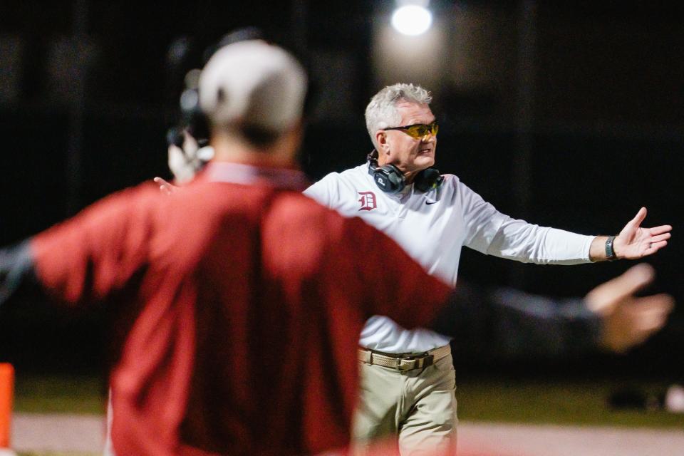 Dover's head coach Dan Ifft argues a call for measurement during the game against Canton South, Friday, Aug. 25 at Clyde Brechbuhler Stadium in Canton.