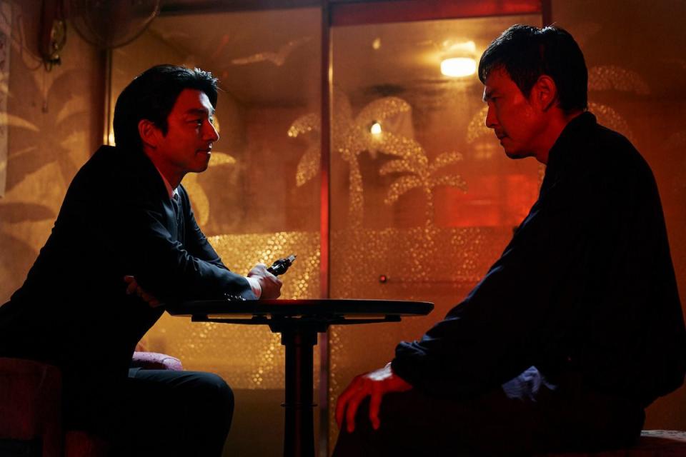 a still from squid game season 2 featuring lee jung jae and gong yoo