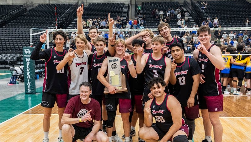 Pine View players pose with the championship trophy after defeating Orem in five sets in the 4A boys volleyball state championship held at the UCCU Center in Orem on Saturday, May 11, 2024.