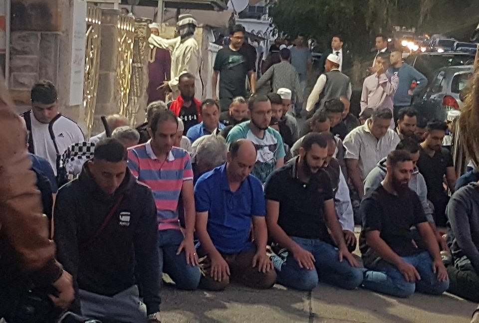 Worshippers pray for victims and families of the Christchurch shootings during an evening vigil a the Lakemba Mosque in Wakemba, New South Wales, Australia.