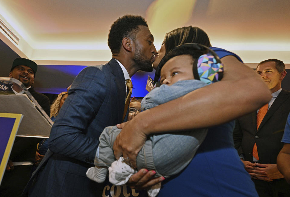 Baltimore Mayor Brandon Scott kisses his fiancee Hanna Pugh while declaring victory during a Democratic primary election night watch party Tuesday, May 14, 2024, in Port Covington, Md. (Kenneth K. Lam/The Baltimore Sun via AP)