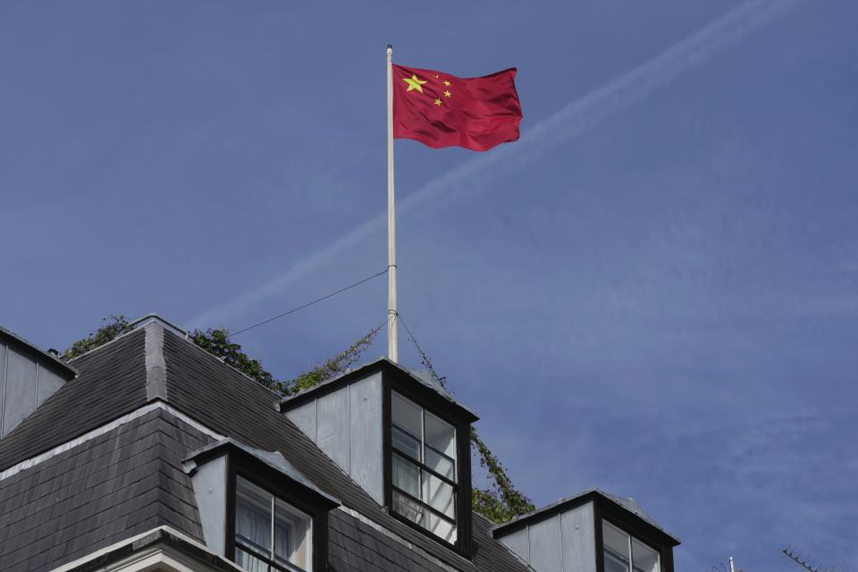 Chinese national flag is raised at the Chinese embassy in London, Monday, Sept. 11, 2023. Prime Minister Rishi Sunak has chastised China's premier for what he called unacceptable interference in British democracy after a newspaper reported that a researcher in Parliament was arrested earlier this year on suspicion of spying for Beijing. (AP Photo/Kin Cheung)