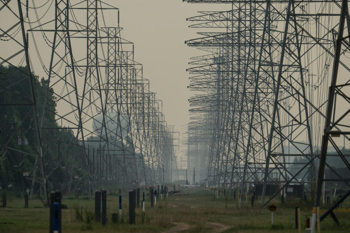 A crowd of electric transmission towers in Houston, Texas, June 16, 2023. (Go Nakamura/The New York Times)