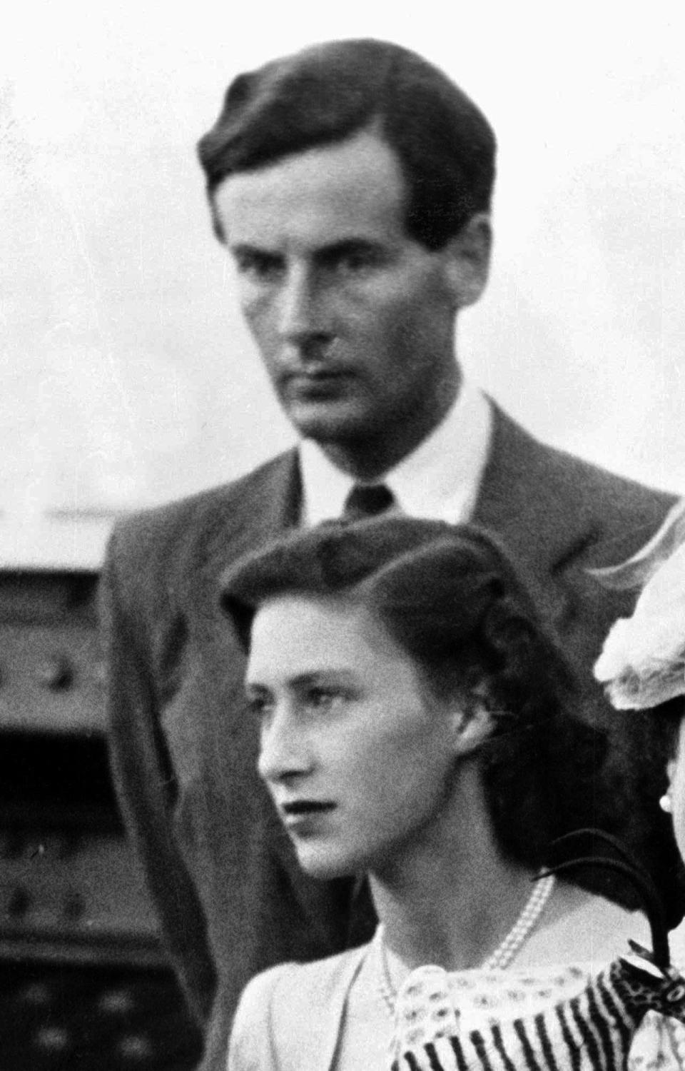 One of the first personal crises of the queen's reign took place soon after the coronation when news broke that her sister Princess Margaret was in love with ex-World War II flying ace Group Capt. Peter Townsend, a divorced man who was one of her father's former equerries. The queen wished her sister to be happy, but her government was against the marriage, too soon after the abdication of Edward VIII over his wish to marry a divorced woman. In October 1955, Margaret, under pressure from the church and a threat to her status as a royal princess, issued a statement declaring she would not marry Townsend. It was a blow painful for both sisters. Here, the couple are seen in 1947 during a royal tour of South Africa. Townsend died in 1995 at age 80.