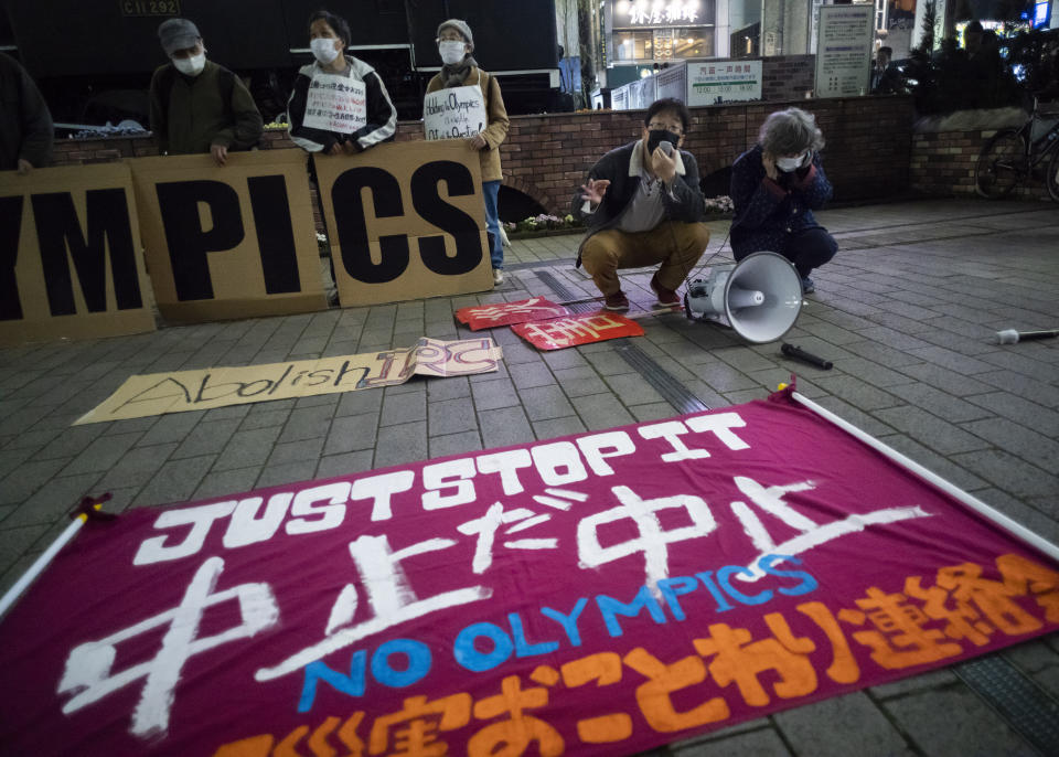 FILE - In this March 25, 2021, file photo, a "No Olympics" banner is placed by protesters in Tokyo during a demonstration against the going ahead of the Tokyo 2020 Olympic and Paralympic Games. An online petition calling for the Tokyo Olympics to be canceled has gained ten of thousands of signatures since being launched in Japan just a few days ago. The rollout comes with Tokyo, Osaka and several other areas under a state of emergency with coronavirus infections rising — particularly new variants. (AP Photo/Hiro Komae, File)