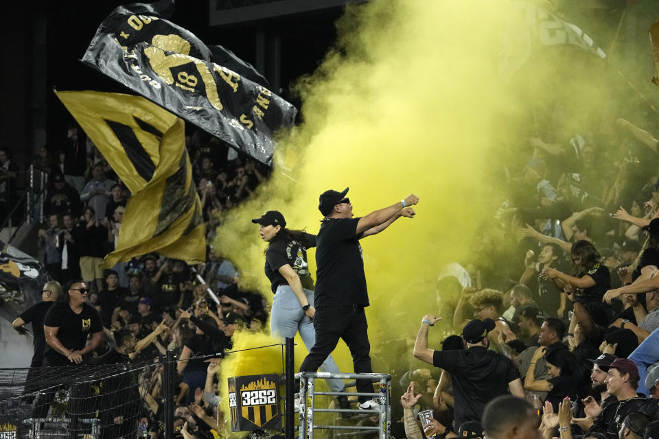 Fans cheer during the second half of a Major League Soccer match between the Los Angeles FC and the Seattle Sounders Wednesday, June 21, 2023, in Los Angeles. (AP Photo/Mark J. Terrill)