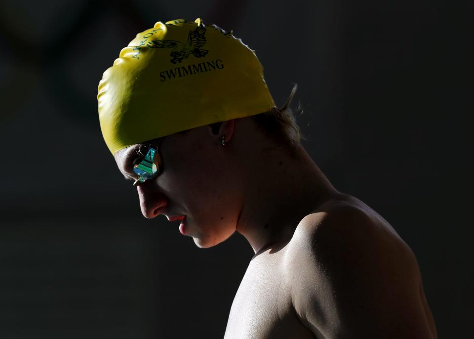 Firestone senior swimmer Jonny Marshall prepares to warm up before his final home meet Jan. 24, 2023.