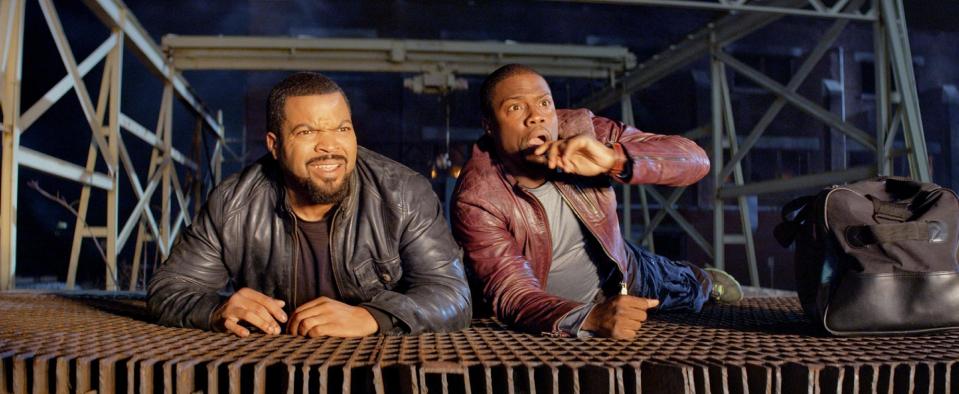 This image released by Universal Pictures shows Ice Cube, left, and Kevin Hart in a scene from the film, "Ride Along." (AP Photo/Universal Pictures, file)