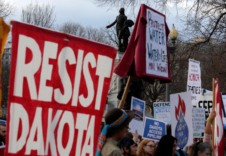 People protest at the White House against President Donald Trump's directive to permit the Dakota Access Pipeline project to move forward in February 2017. (Joshua Roberts / Reuters)