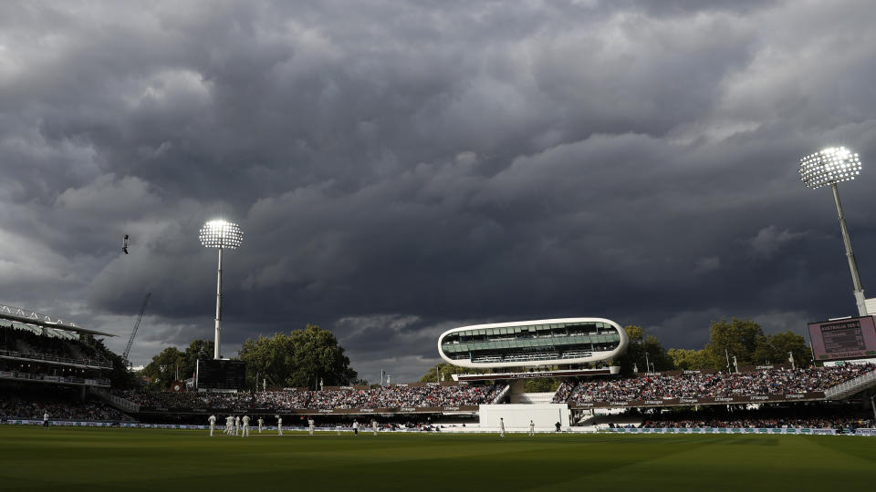 FILE - England's Jack Leach bowls to Australia's Marnus Labuschagne as dark clouds come over the ground during play on day five of the 2nd Ashes Test cricket match between England and Australia at Lord's cricket ground in London, Sunday, Aug. 18, 2019. An independent commission has found that institutional racism, sexism and class-based discrimination continue to infect English cricket. A long-awaited report into the state of the sport was published by the Independent Commission for Equity in Cricket (ICEC). It found that reform was needed to "tackle discrimination, remove barriers and reform the game to make cricket more inclusive." (AP Photo/Alastair Grant, File)