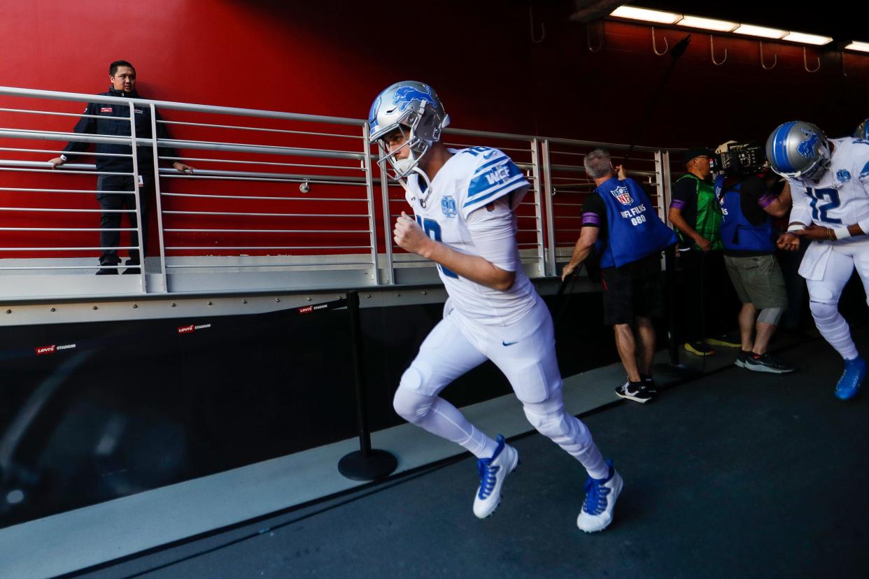 Lions quarterback Jared Goff runs out of the tunnel during warmups before the NFC championship game at Levi's Stadium in Santa Clara, California, on Sunday, Jan. 28, 2024.