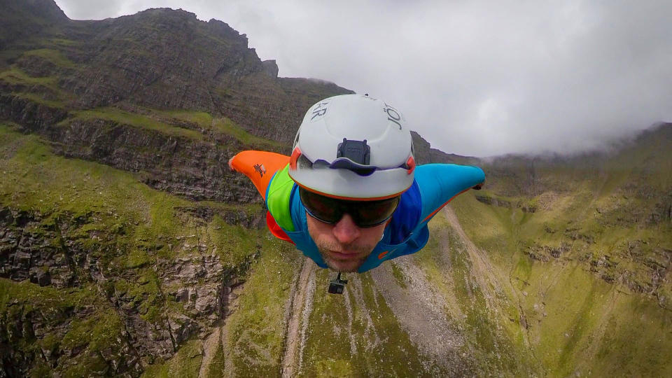 A brave base jumper has become the first person ever to fly a wingsuit from the top of a British mountain. Former Royal Marine Tim Howell, 31, leapt from the 4,000ft peak of An Teallach in the northwest Highlands in Scotland. He plunged down a steep gully for 30 seconds before deploying his parachute and landing safely on the banks of Loch Toll an Lochain.