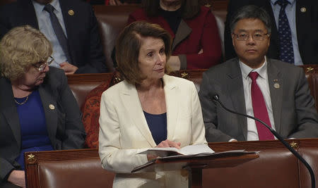 U.S. House Minority Leader Nancy Pelosi (D-CA) is shown reading from a bible during a marathon speech on the floor of the House of Representatives in this still grab taken from video on Capitol Hill in Washington, U.S., February 7, 2018. U.S. House TV/Handout via Reuters