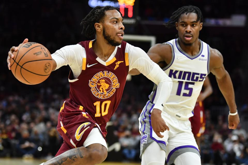 Dec 11, 2021; Cleveland, Ohio, USA; Cleveland Cavaliers guard Darius Garland (10) drives to the basket against Sacramento Kings guard Davion Mitchell (15) during the second half at Rocket Mortgage FieldHouse. Mandatory Credit: Ken Blaze-USA TODAY Sports