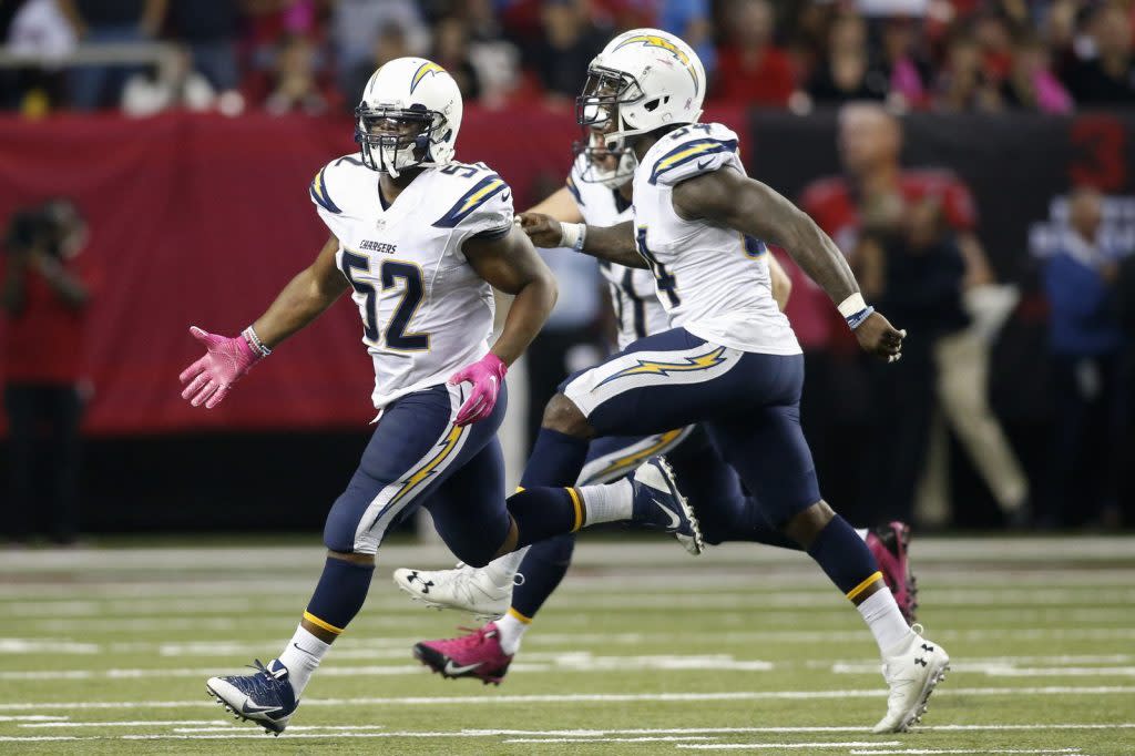 Oct 23, 2016; Atlanta, GA, USA; San Diego Chargers inside linebacker Denzel Perryman (52) and outside linebacker Melvin Ingram (54) celebrate after a defensive stop against the Atlanta Falcons in overtime at the Georgia Dome. The Chargers defeated the Falcons 33-30 in overtime. Mandatory Credit: Brett Davis-USA TODAY Sports