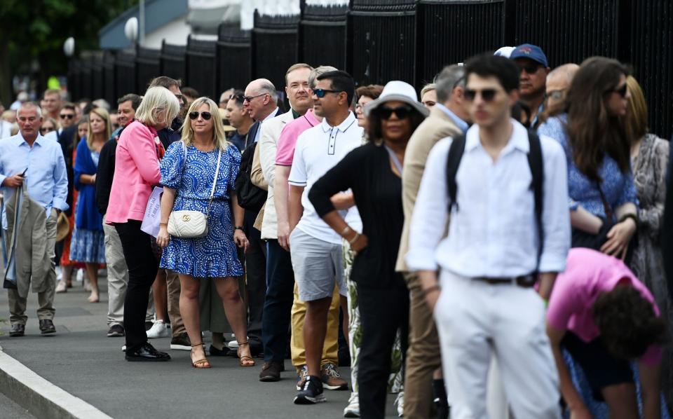 Spectators queue outside the ground waiting to enter before the start of play on the first day of the 135th Wimbledon Championships, in Wimbledon, Britain, 27 June 2022 - The mystery of the 6,000 missing Wimbledon fans - and why The Queue is losing its charm - SHUTTERSTOCK