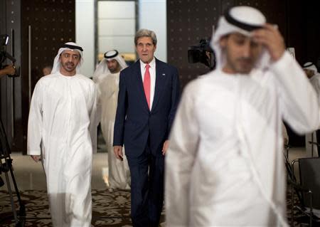 U.S. Secretary of State John Kerry arrives at a news conference with UAE Foreign Minister Abdullah bin Zayed Al Nahyan (L) at the Foreign Ministry in Abu Dhabi November 11, 2013. REUTERS/Jason Reed