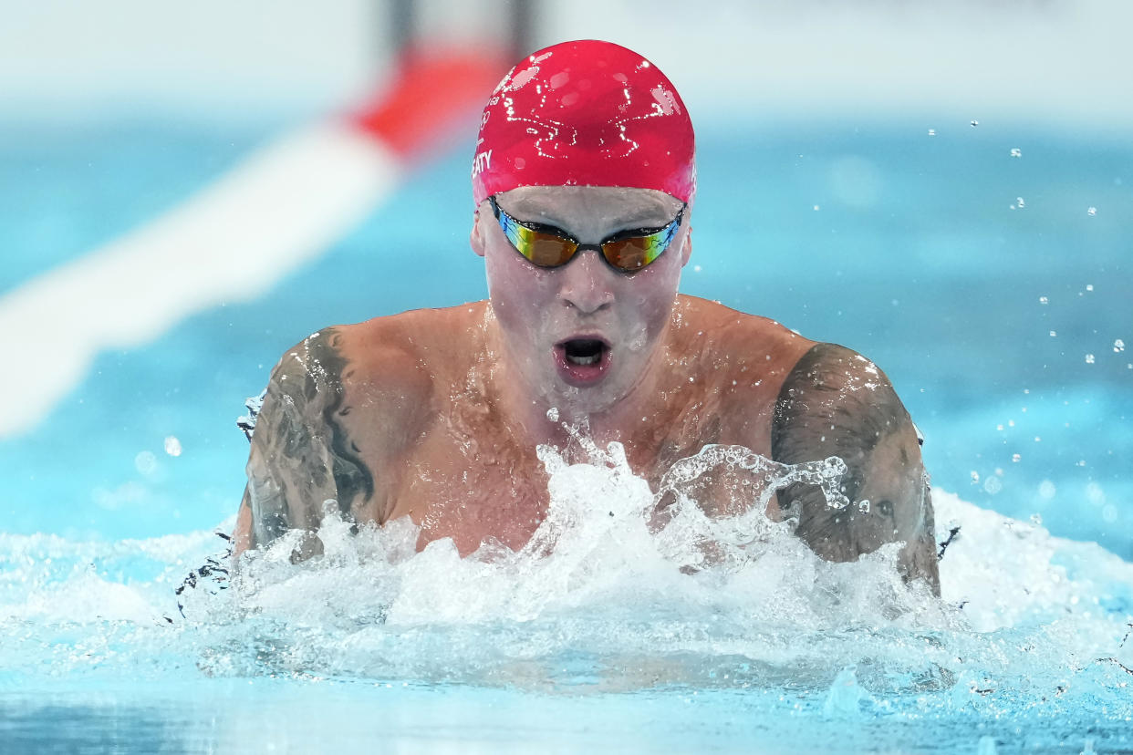 Adam Peaty, of Britain, competes in the men's 100-meter breaststroke final at the 2024 Summer Olympics, Sunday, July 28, 2024, in Nanterre, France. (AP Photo/Matthias Schrader)