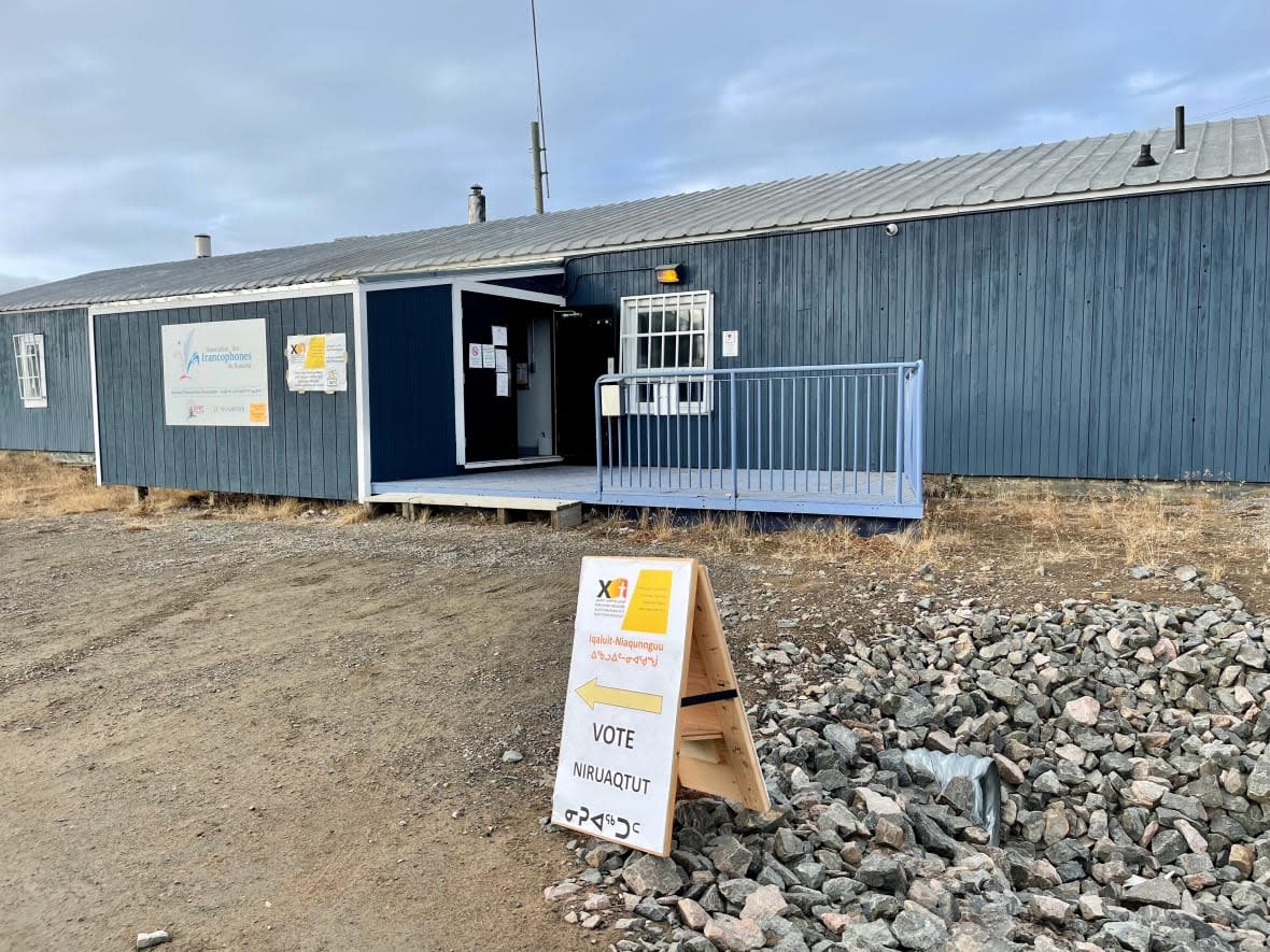 Voting signs point the way to the Iqaluit-Manirajak polling station in Iqaluit. The territory will elect its sixth legislative assembly Monday.  (Jane George/CBC - image credit)