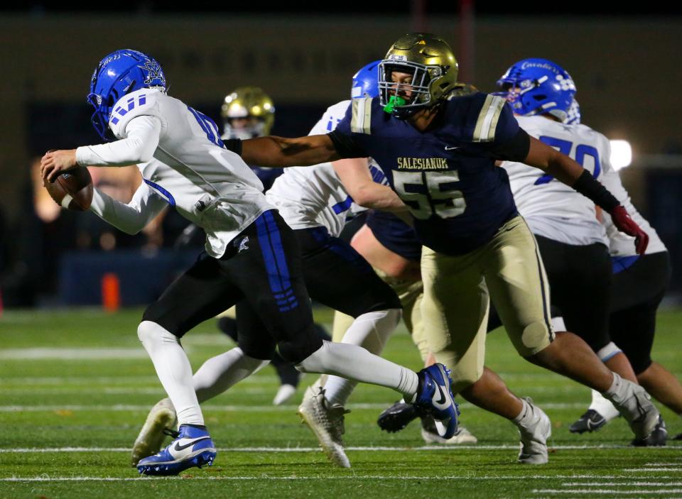 Salesianum's Ahmaad Foster pursues Middletown's Austin Troyer as the Cavs struggle to come back in the fourth quarter of Salesianum's 24-14 win in a DIAA Class 3A state tournament semifinal at Abessinio Stadium, Friday, Nov. 24, 2023.