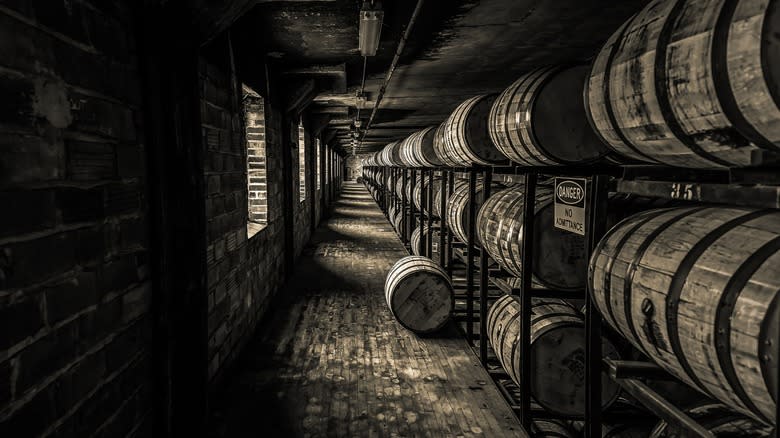 Racks of bourbon barrels in a store house