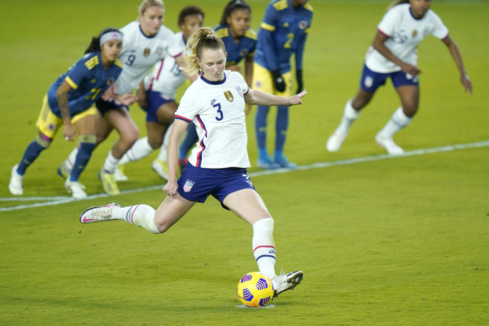 United States midfielder Samantha Mewis (3) scores a goal on a penalty kick during the second half of an international friendly soccer match against Colombia, Monday, Jan. 18, 2021, in Orlando, Fla. (AP Photo/John Raoux)